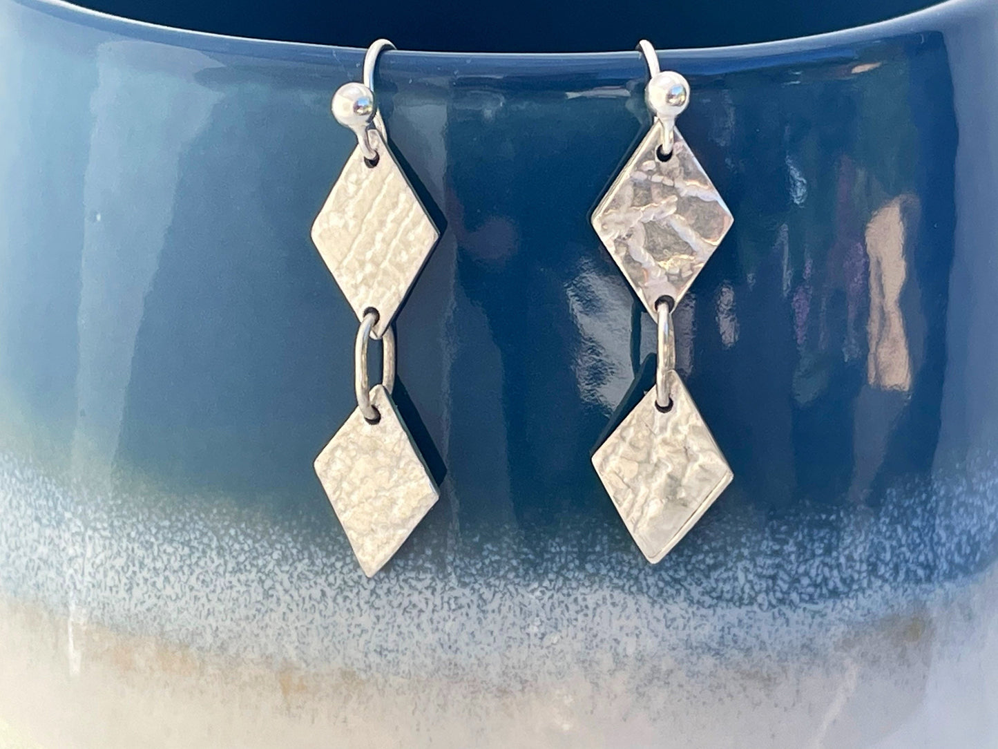 Handmade textured geometric drop earrings.